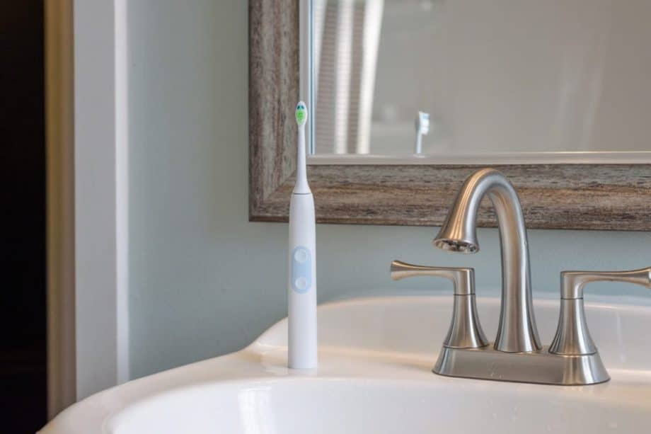 electric toothbrush sitting on sink