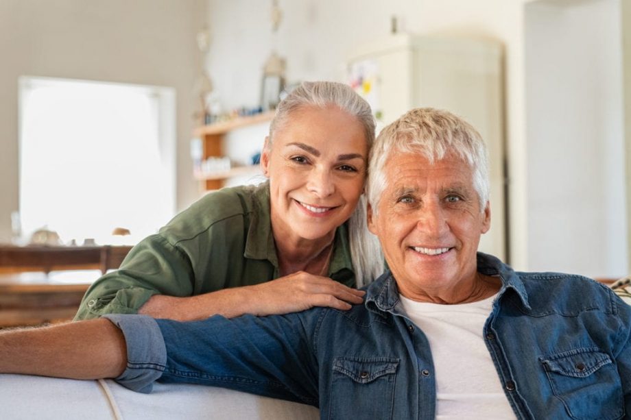 older couple on white couch