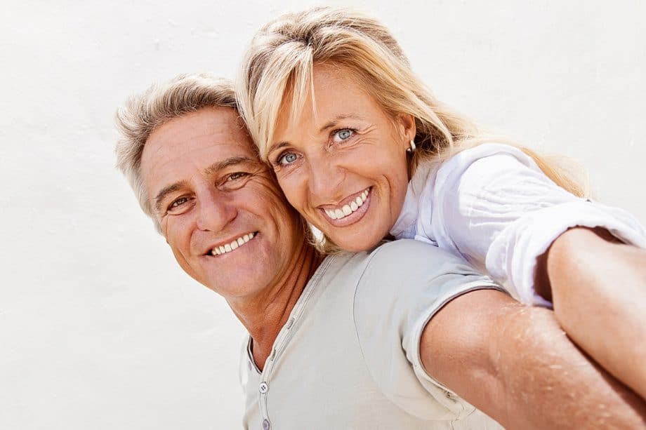 older couple taking a selfie together