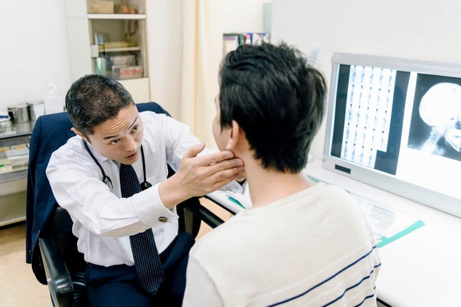 dentist examining patient's jaw