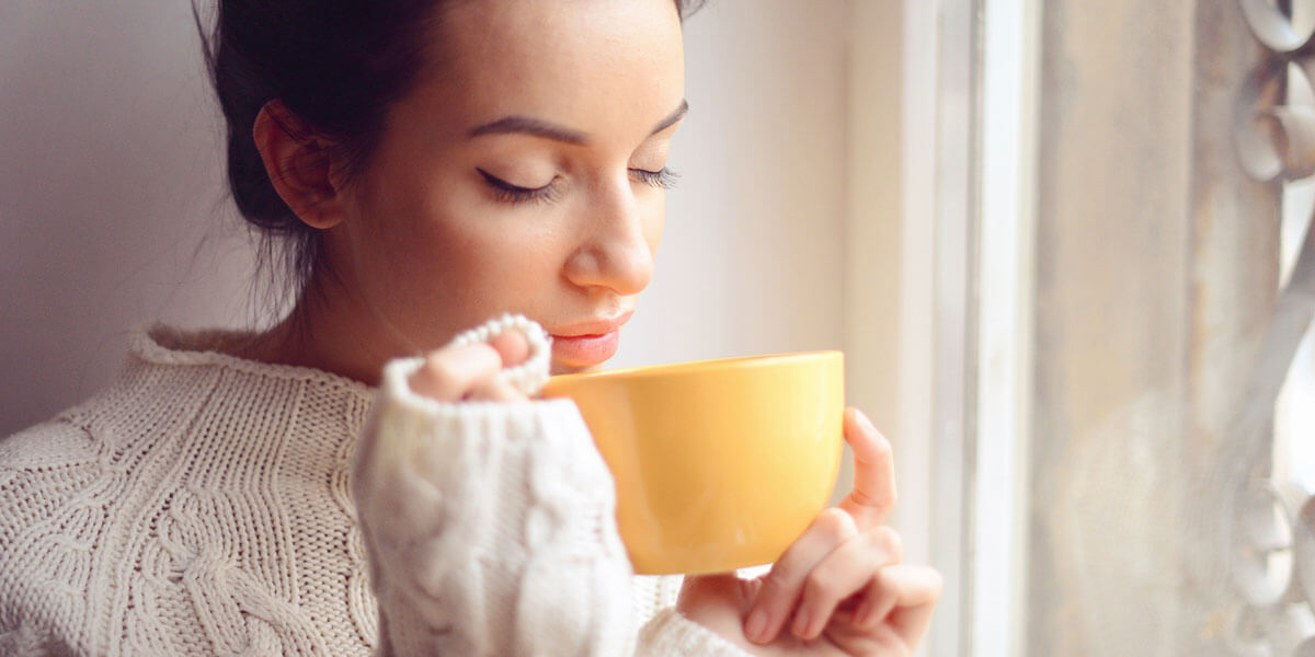 Woman holding a cup of tea