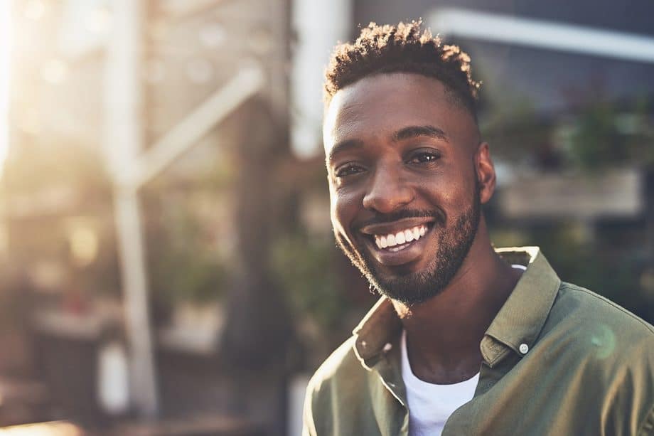 smiling man looking toward camera